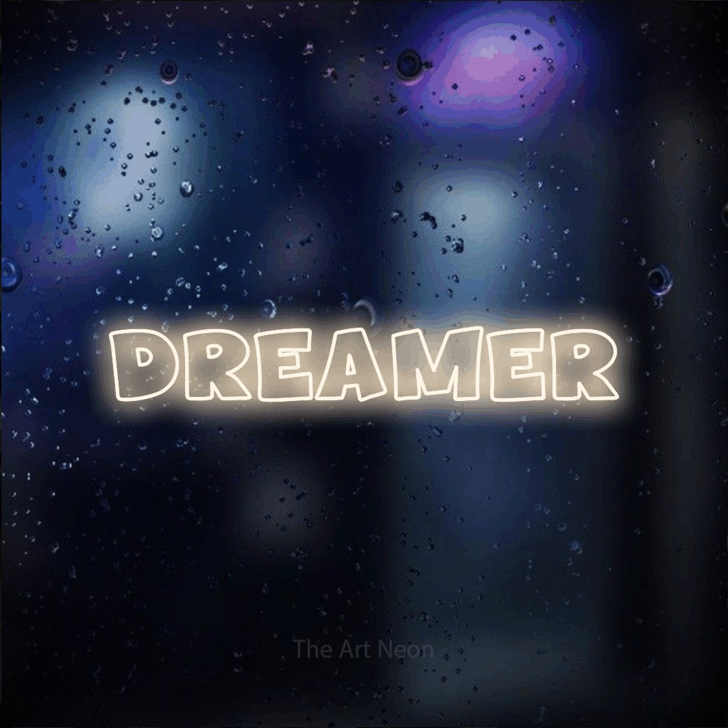 LED neon sign reading “DREAMER”, arranged in a single line.
