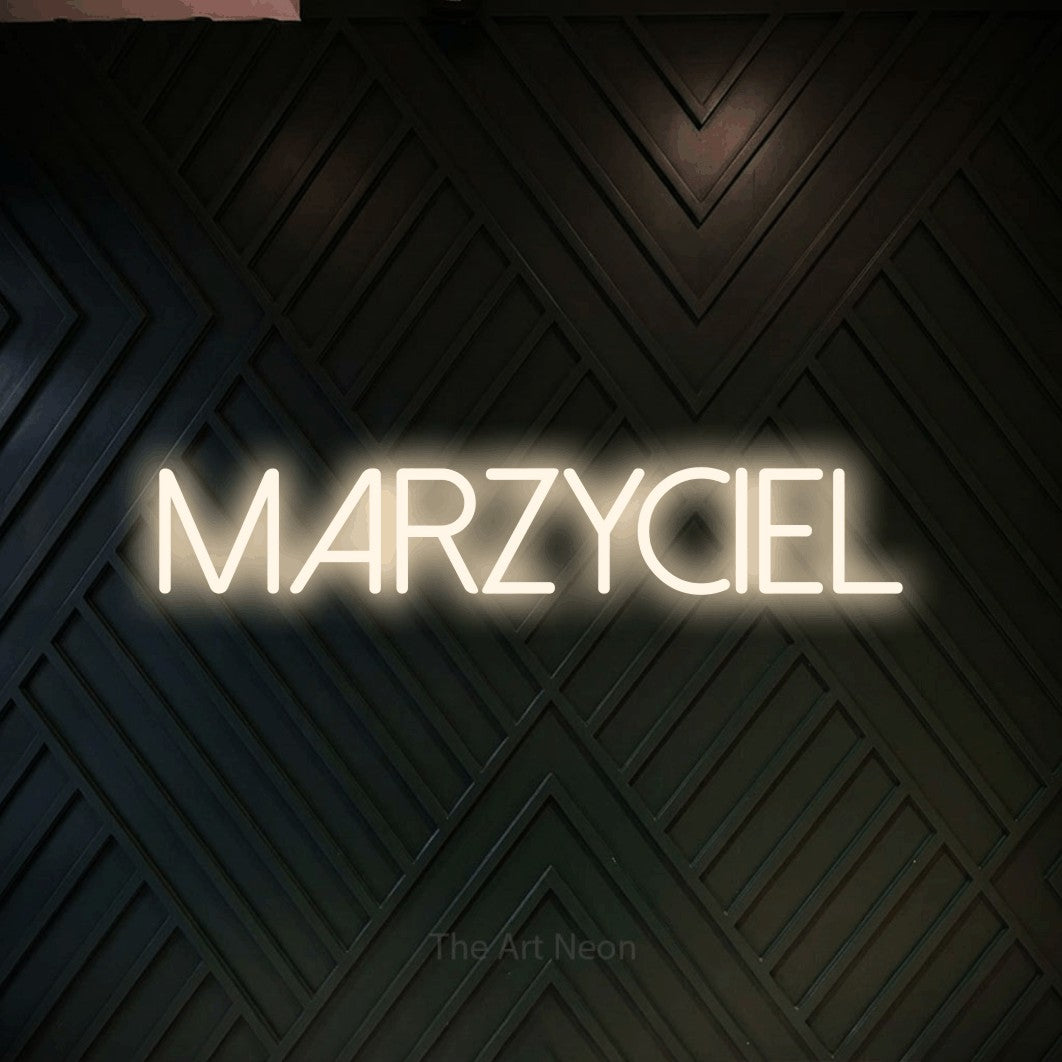 LED neon sign reading “MARZYCIEL”, arranged in a single line.