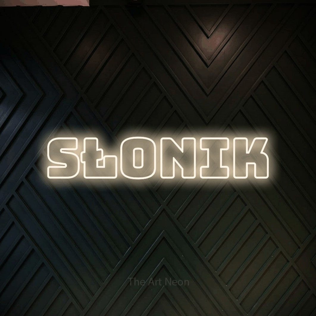 LED neon sign reading “SŁONIK”, arranged in a single line.