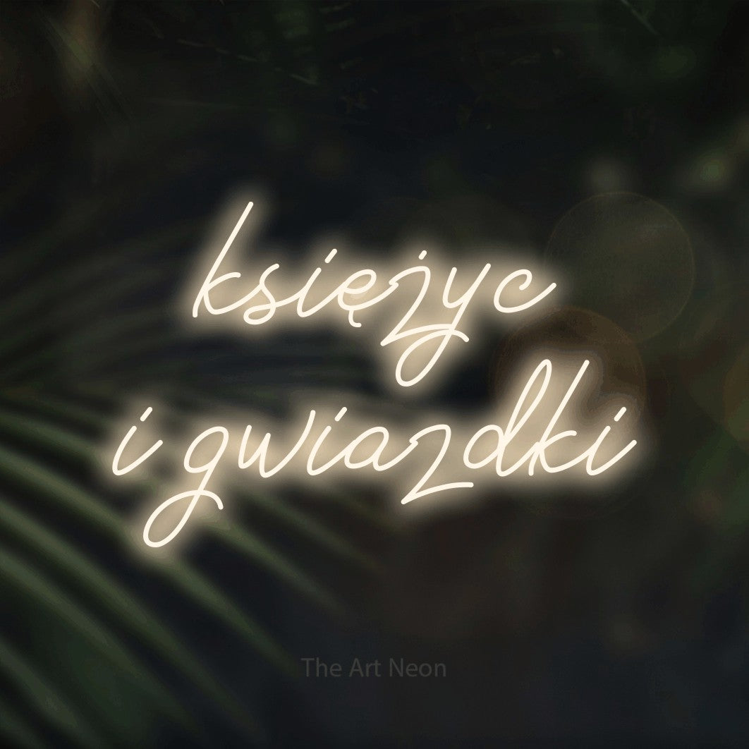 LED neon sign reading “księżyc i gwiazdki”, arranged in two lines.