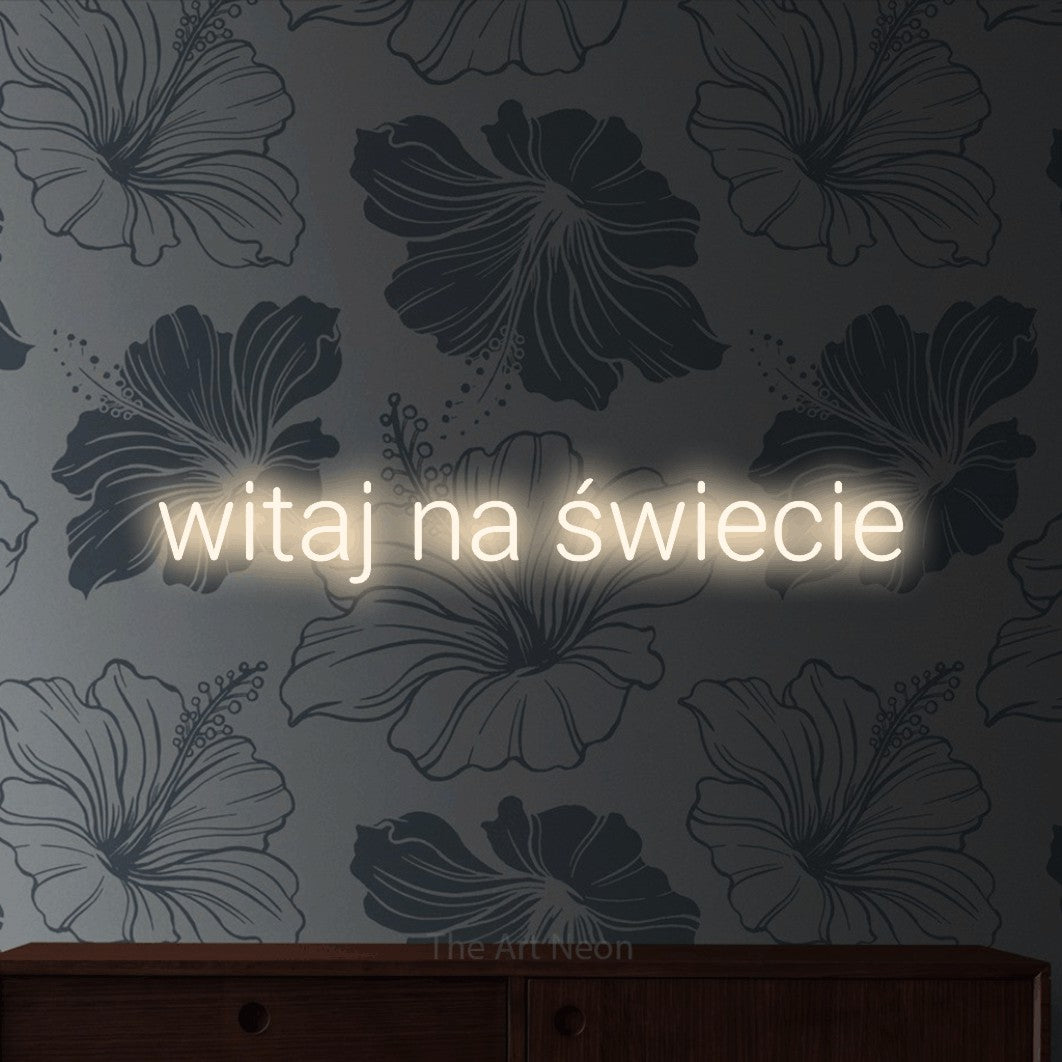 LED neon sign reading “witaj na świecie”, arranged in a single line.