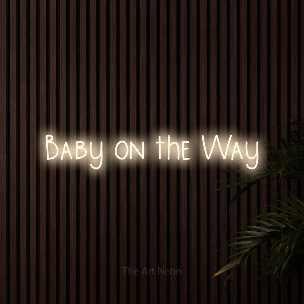 LED neon sign reading “Baby on the Way”, arranged in a single line.