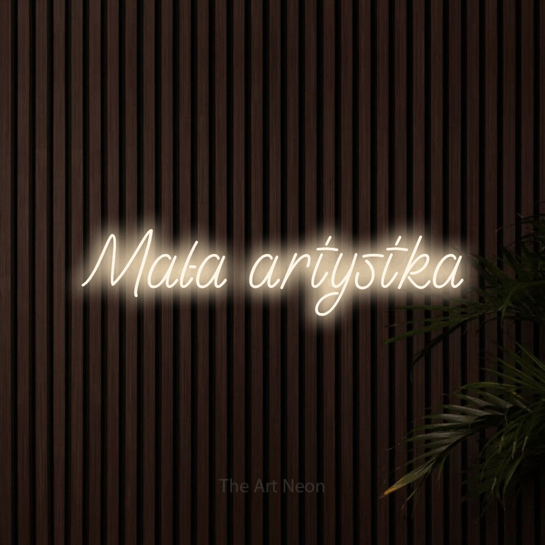 LED neon sign reading “Mała artystka”, arranged in a single line.