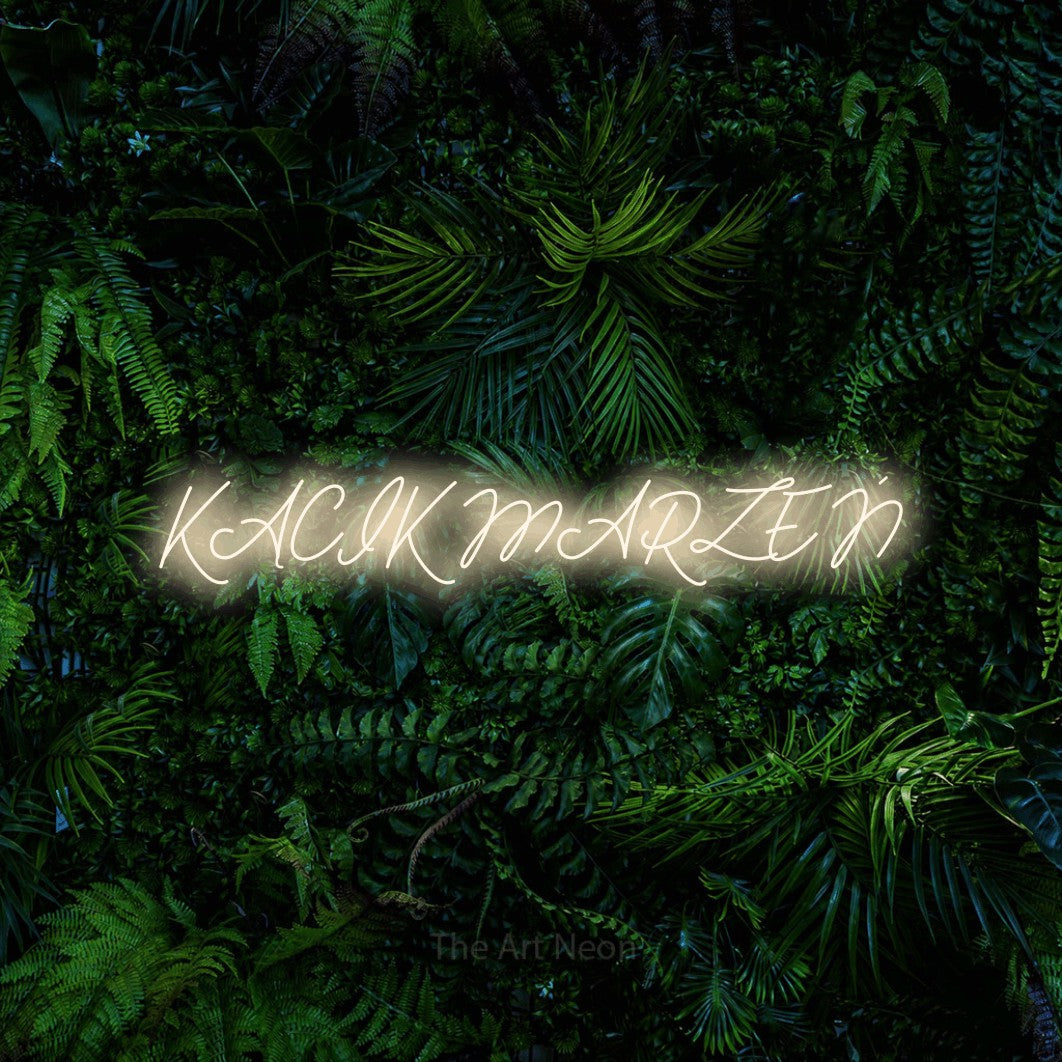 LED neon sign reading “KĄCIK MARZEŃ”, arranged in a single line.