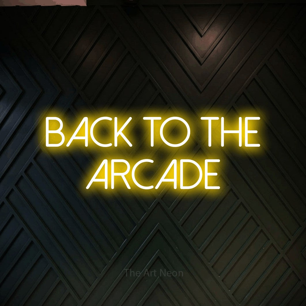 LED neon sign reading “BACK TO THE ARCADE”, arranged in two lines.