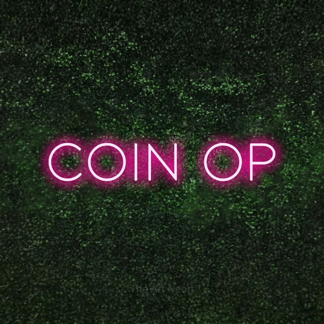 LED neon sign reading “Coin Op”, arranged in a single line.