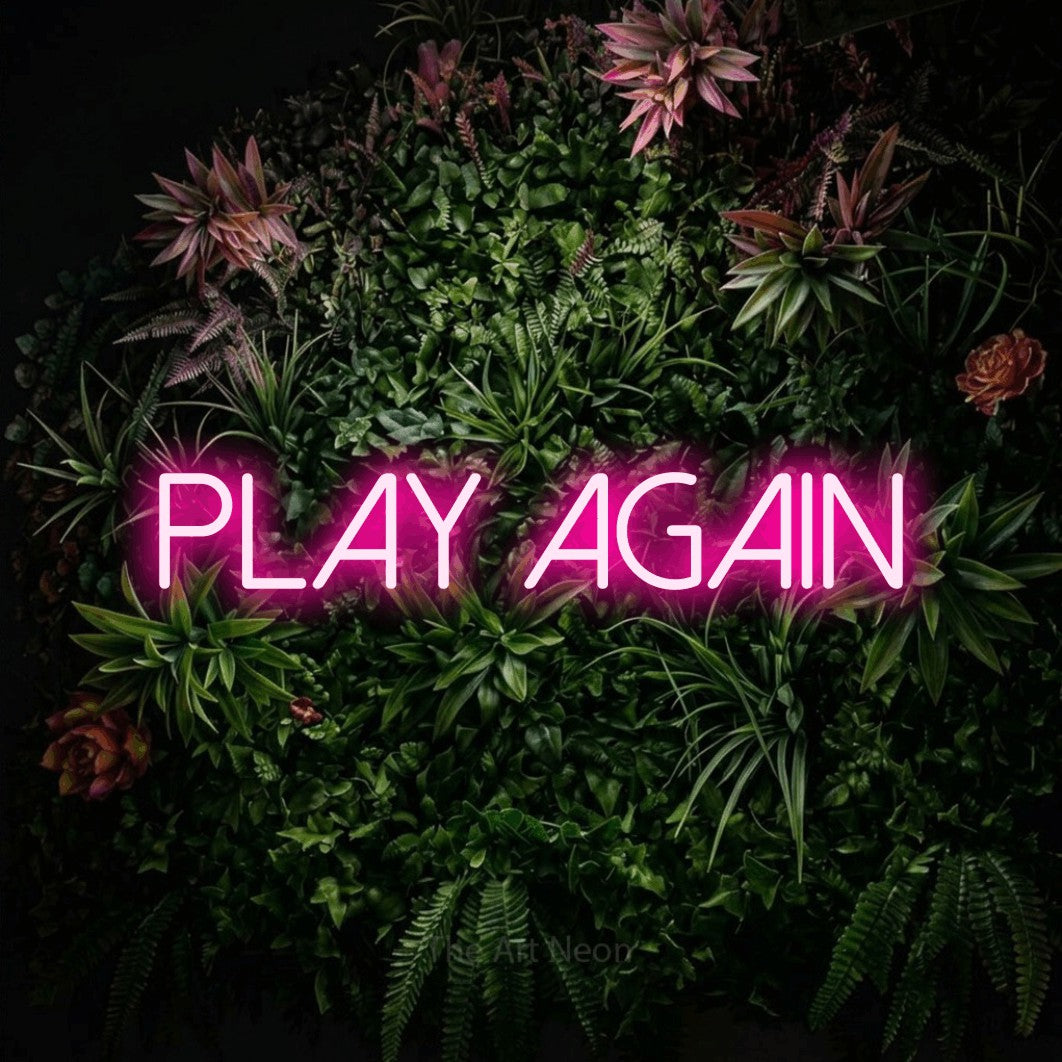 LED neon sign reading “play AGAIN”, arranged in a single line.