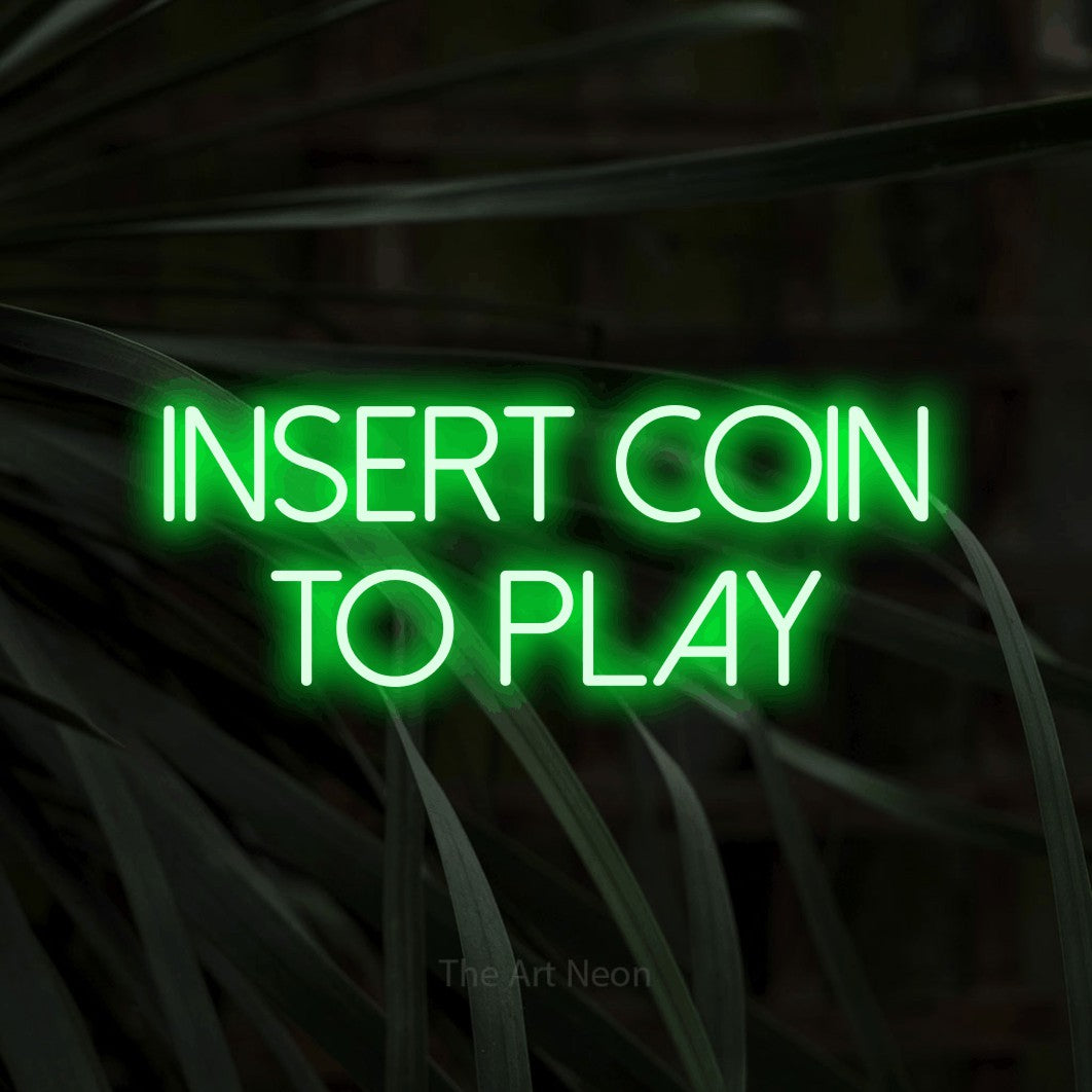 LED neon sign reading “INSERT COIN TO PLAY”, arranged in two lines.