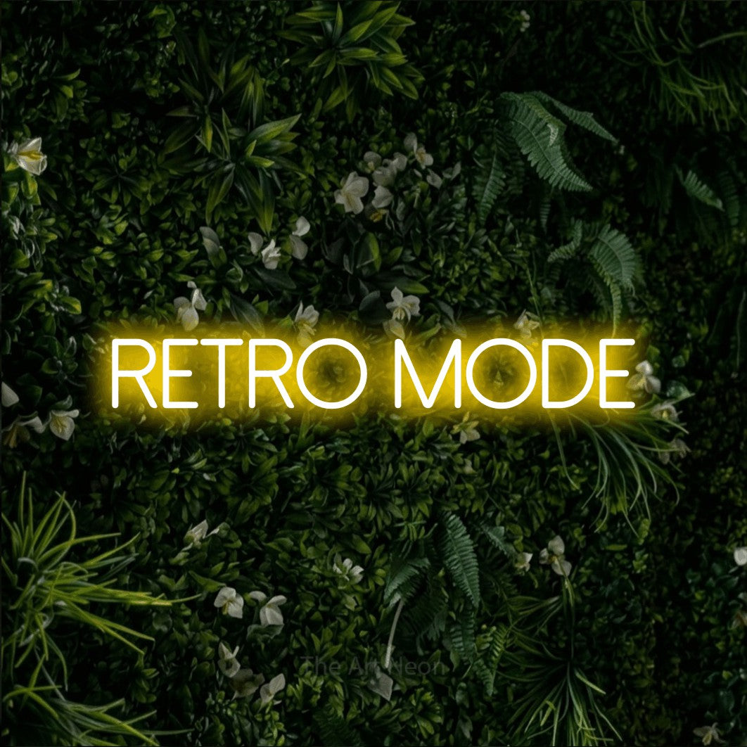 LED neon sign reading “retro mode”, arranged in a single line.