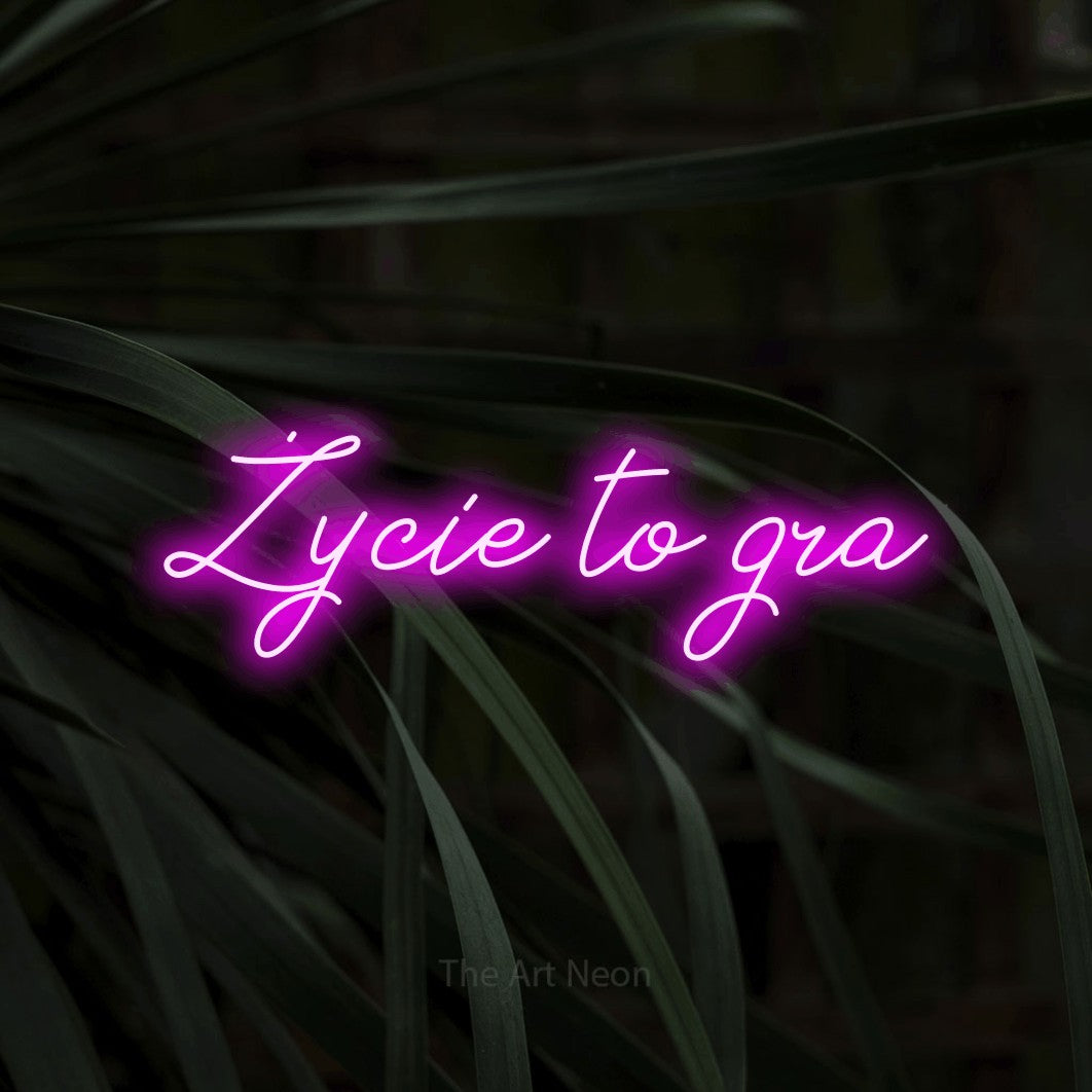 LED neon sign reading “Życie to gra”, arranged in a single line.