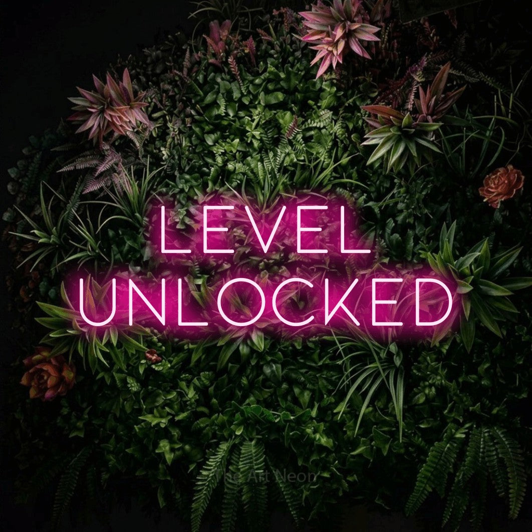 LED neon sign reading “LEVEL UNLOCKED”, arranged in two lines.