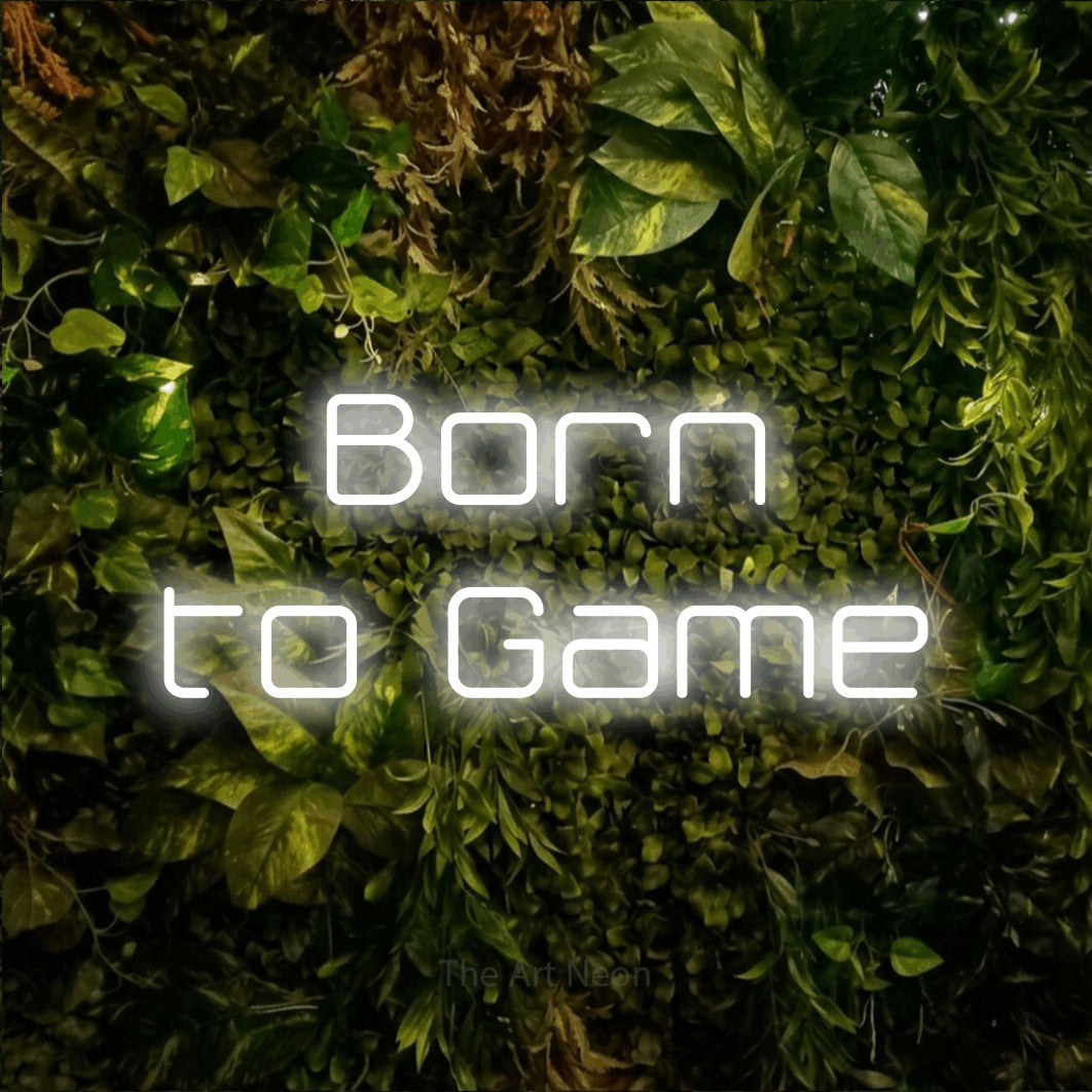LED neon sign reading “Born to Game”, arranged in two lines.