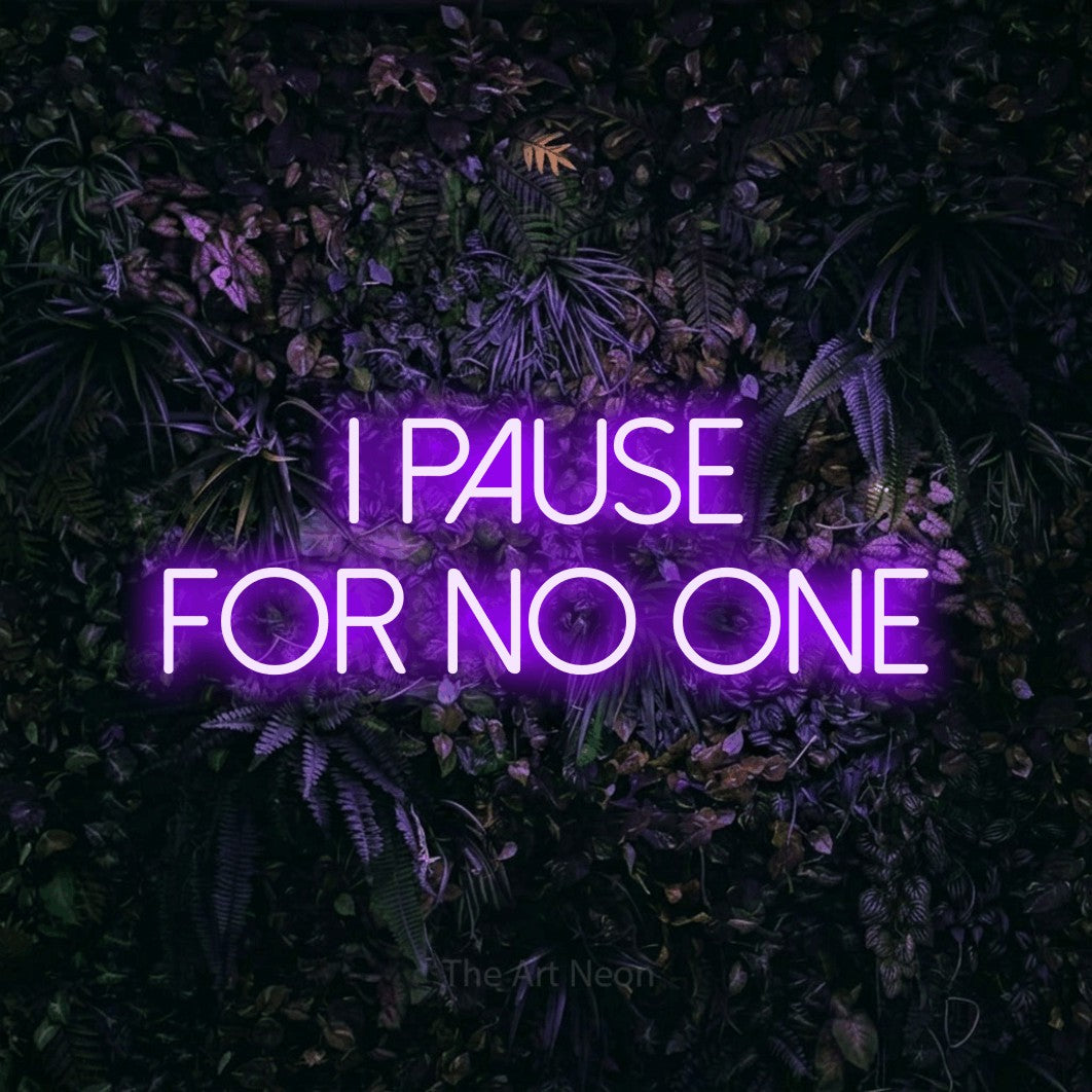 LED neon sign reading “I PAUSE FOR NO ONE”, arranged in two lines.