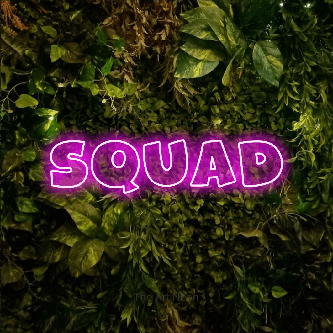 LED neon sign reading “SQUAD”, arranged in a single line.