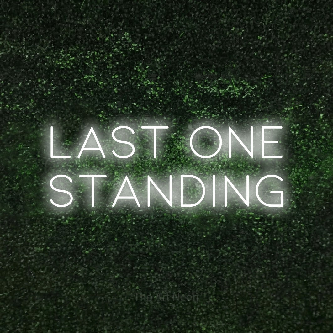LED neon sign reading “last one STANDING”, arranged in two lines.