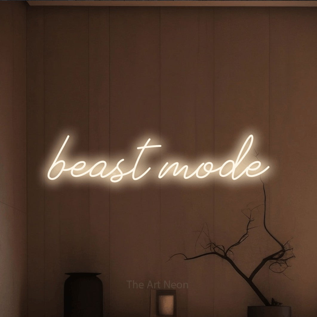 LED neon sign reading “beast mode”, arranged in a single line.