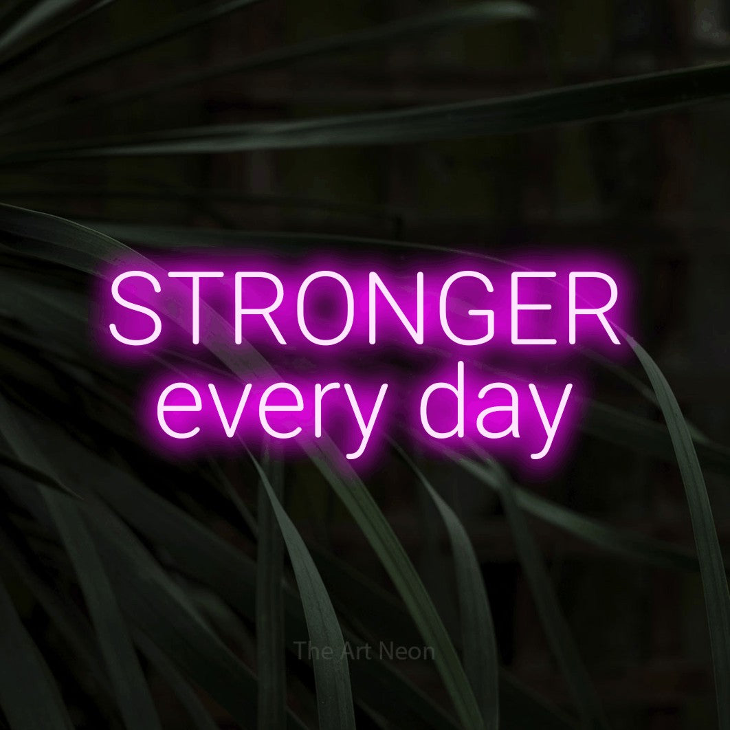 LED neon sign reading “STRONGER every day”, arranged in two lines.