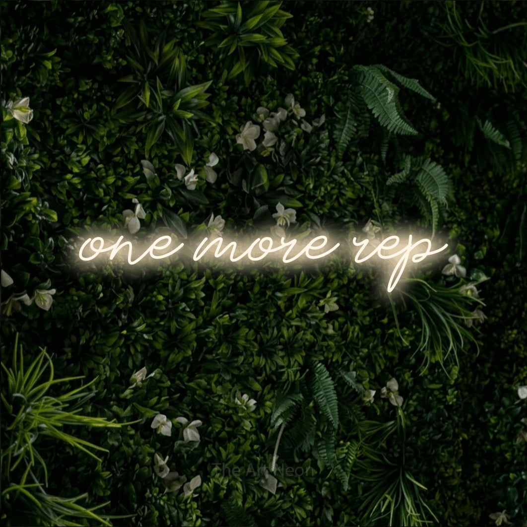 LED neon sign reading “one more rep”, arranged in a single line.
