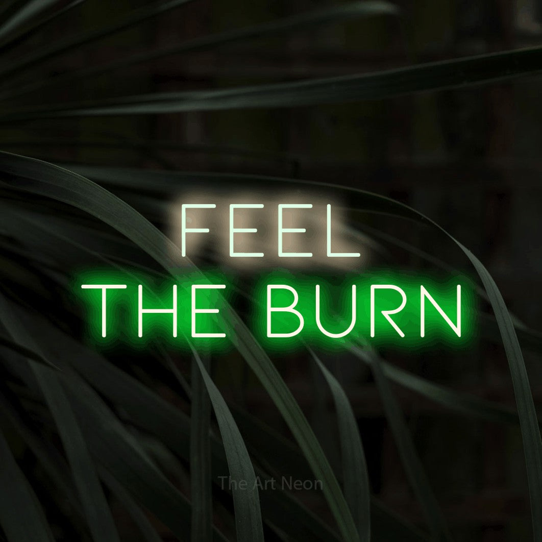 LED neon sign reading “FEEL the burn”, arranged in two lines.