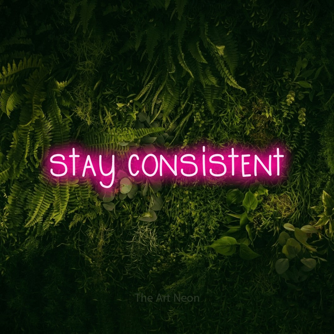 LED neon sign reading “stay consistent”, arranged in a single line.