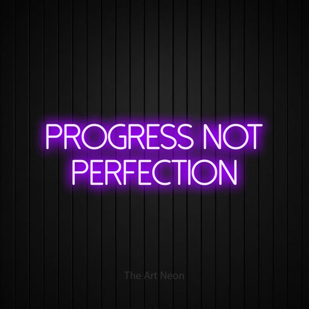 LED neon sign reading “progress not PERFECTION”, arranged in two lines.