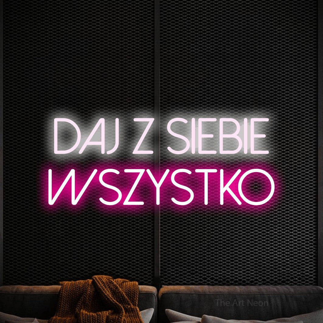 LED neon sign reading “Daj z siebie wszystko”, arranged in two lines.