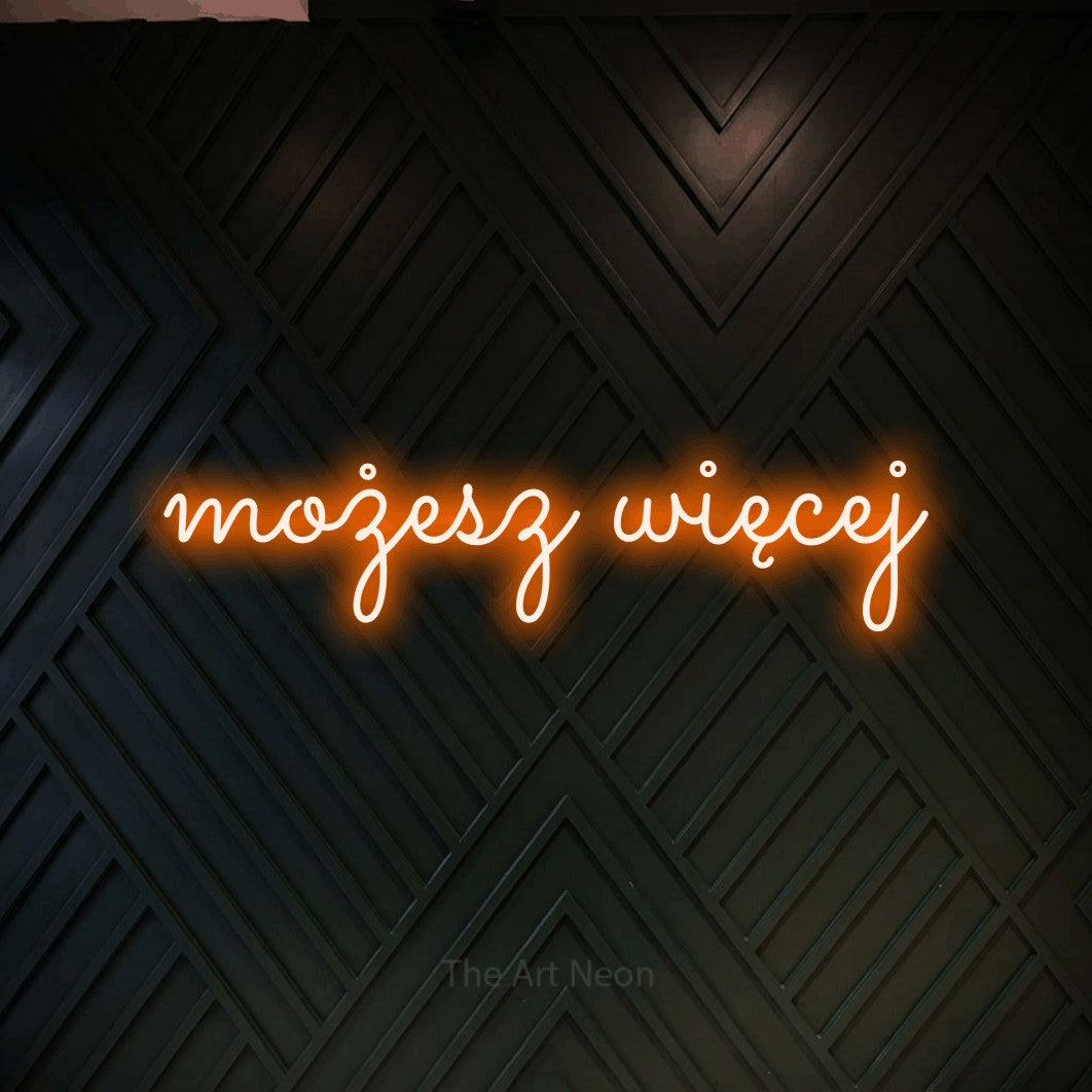 LED neon sign reading “możesz więcej”, arranged in a single line.