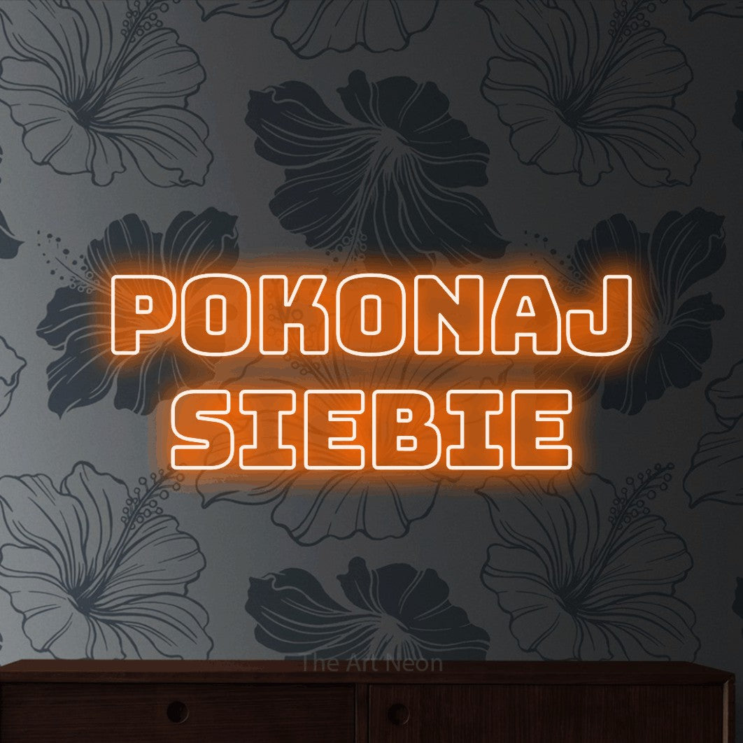 LED neon sign reading “Pokonaj siebie”, arranged in two lines.