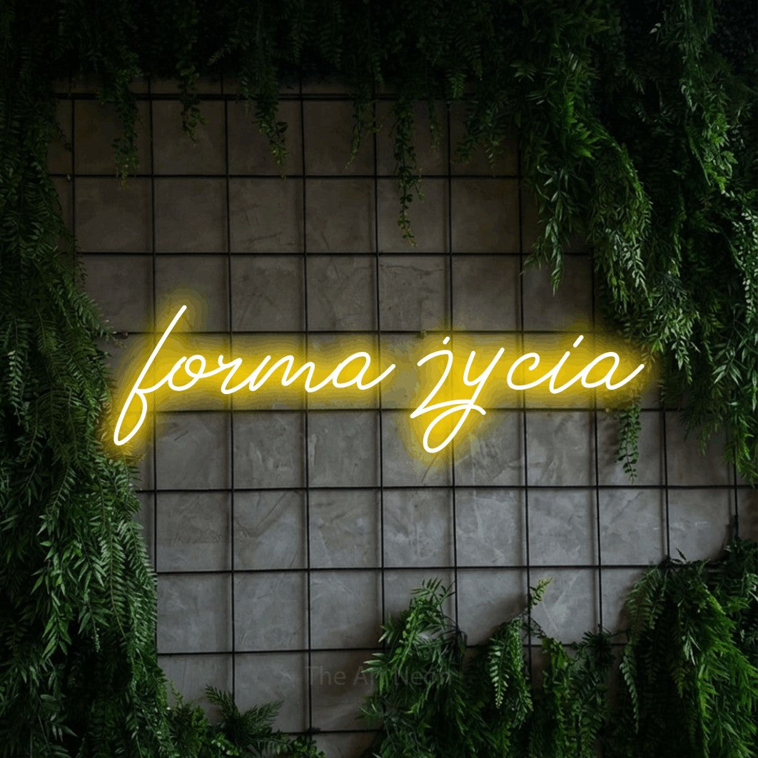 LED neon sign reading “forma życia”, arranged in a single line.