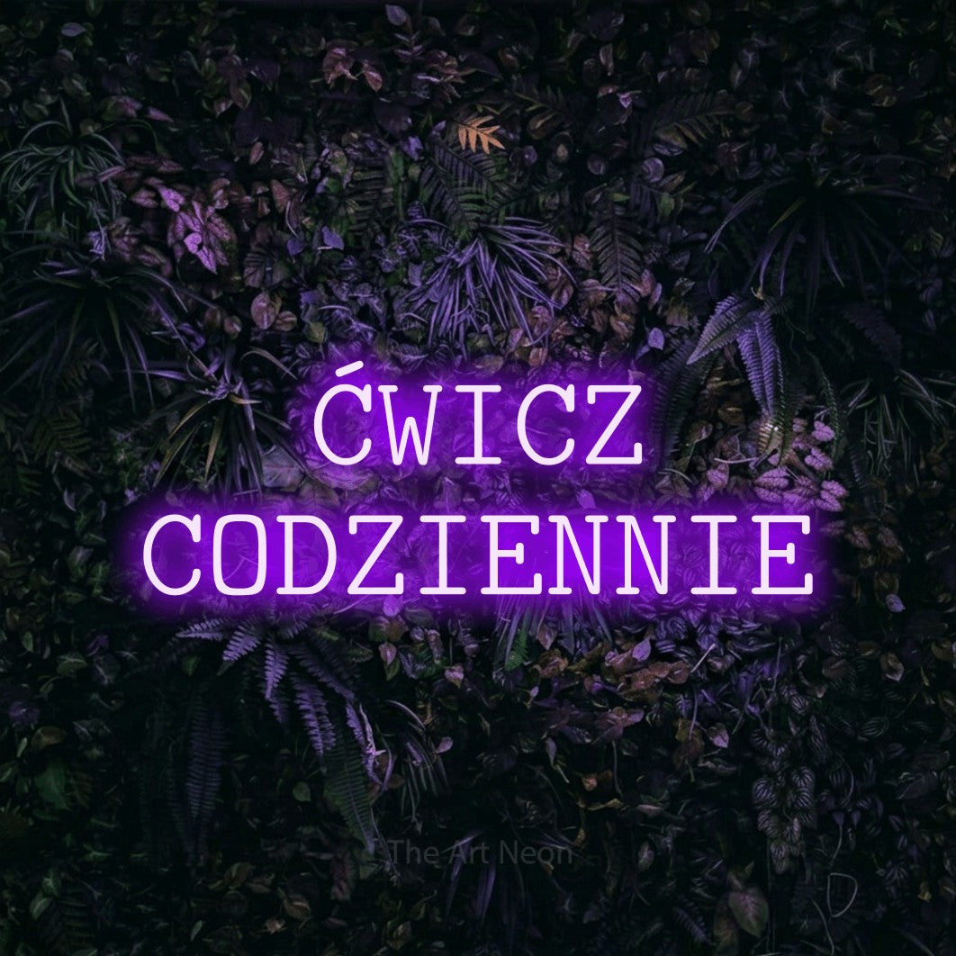 LED neon sign reading “ĆWICZ CODZIENNIE”, arranged in two lines.