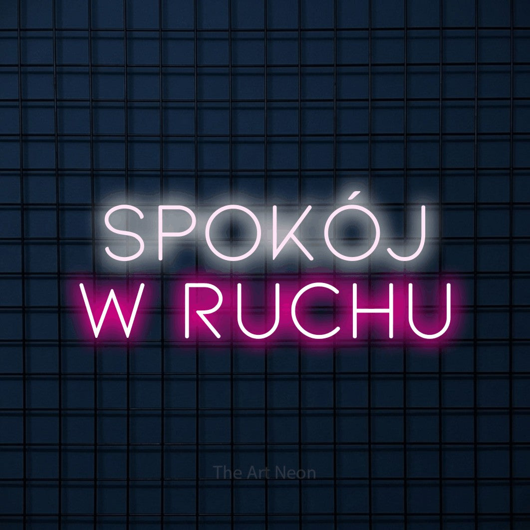 LED neon sign reading “spokój w ruchu”, arranged in two lines.