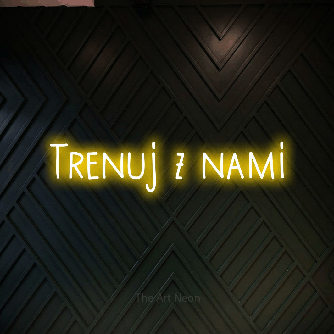 LED neon sign reading “Trenuj z nami”, arranged in a single line.