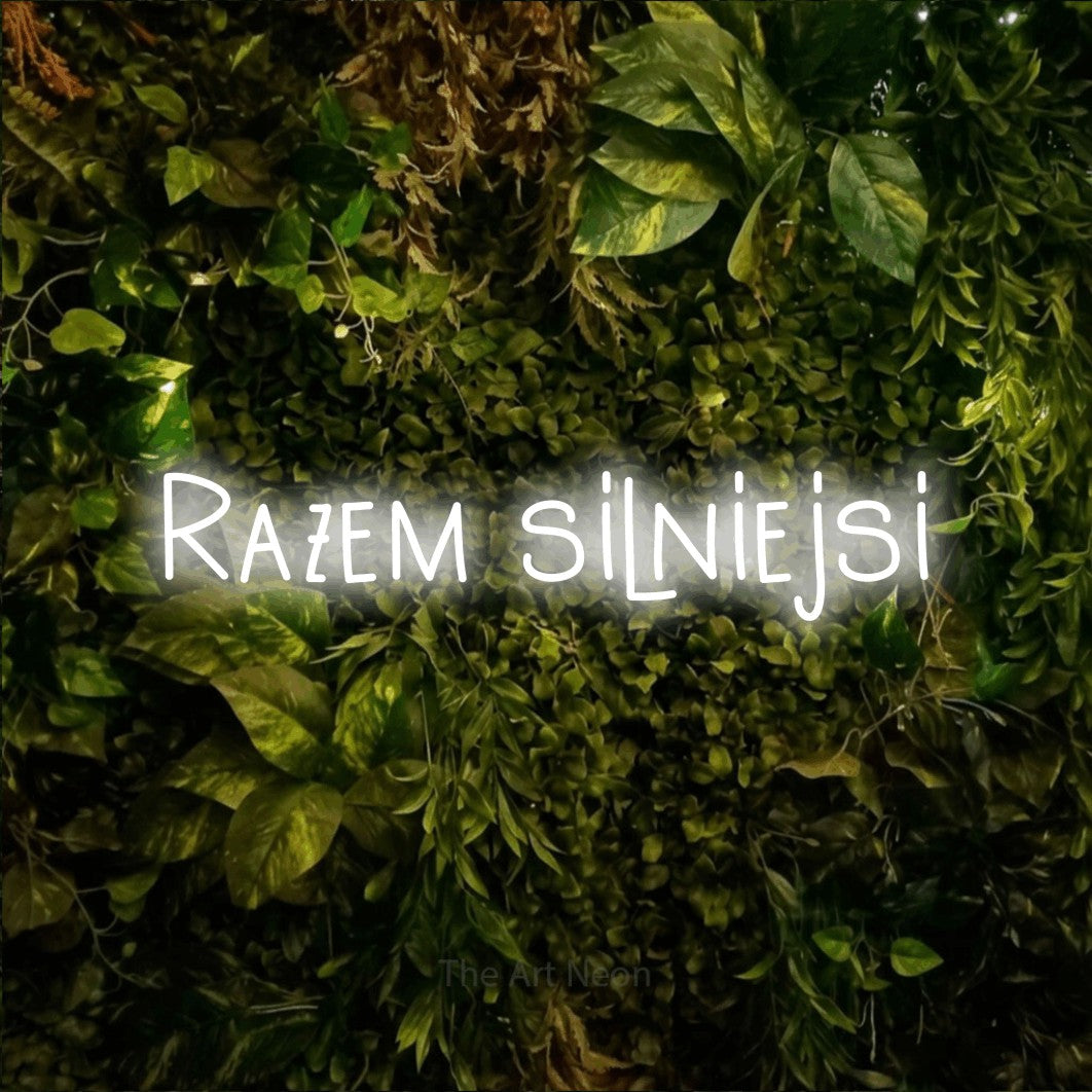LED neon sign reading “Razem silniejsi”, arranged in a single line.