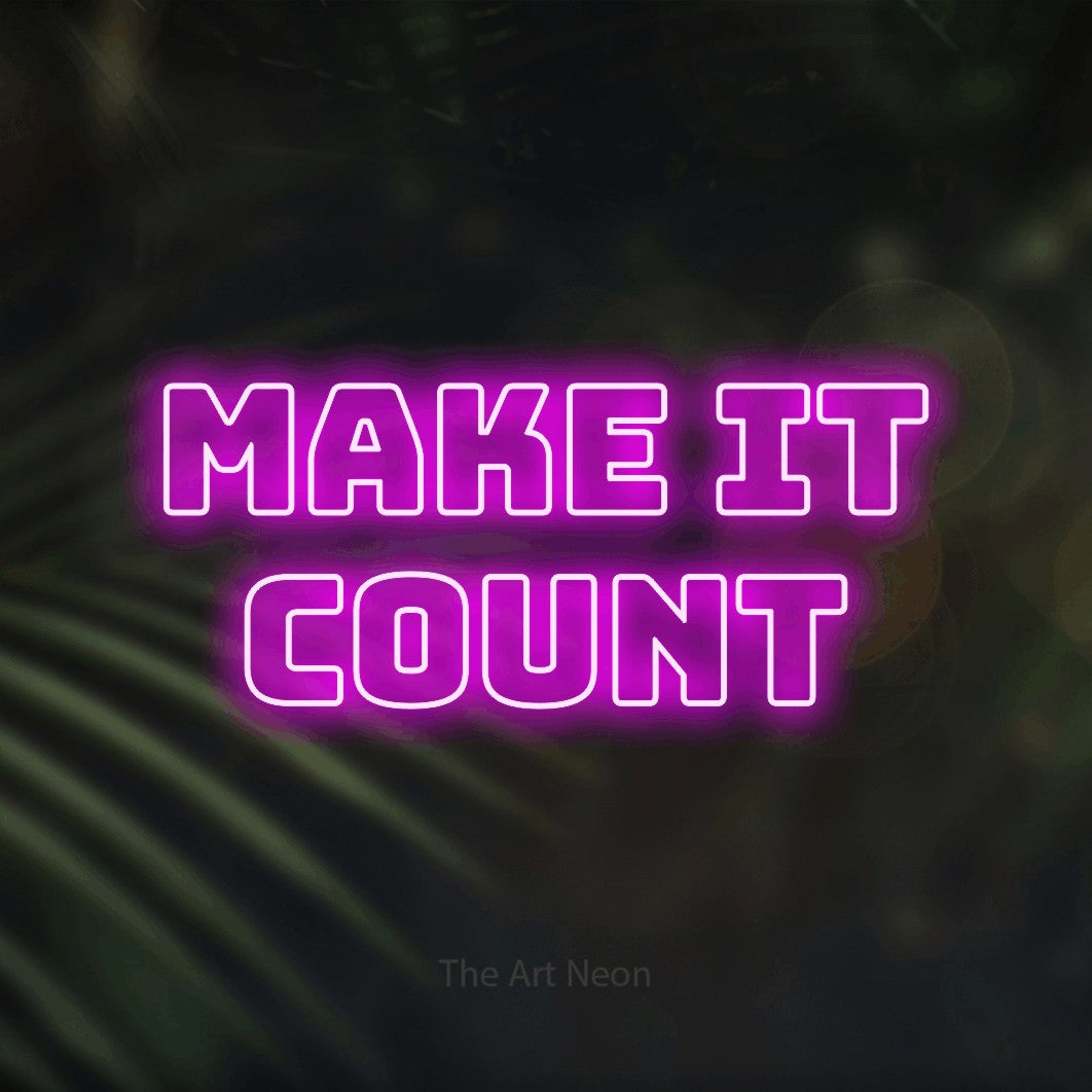 LED neon sign reading “make it COUNT”, arranged in two lines.