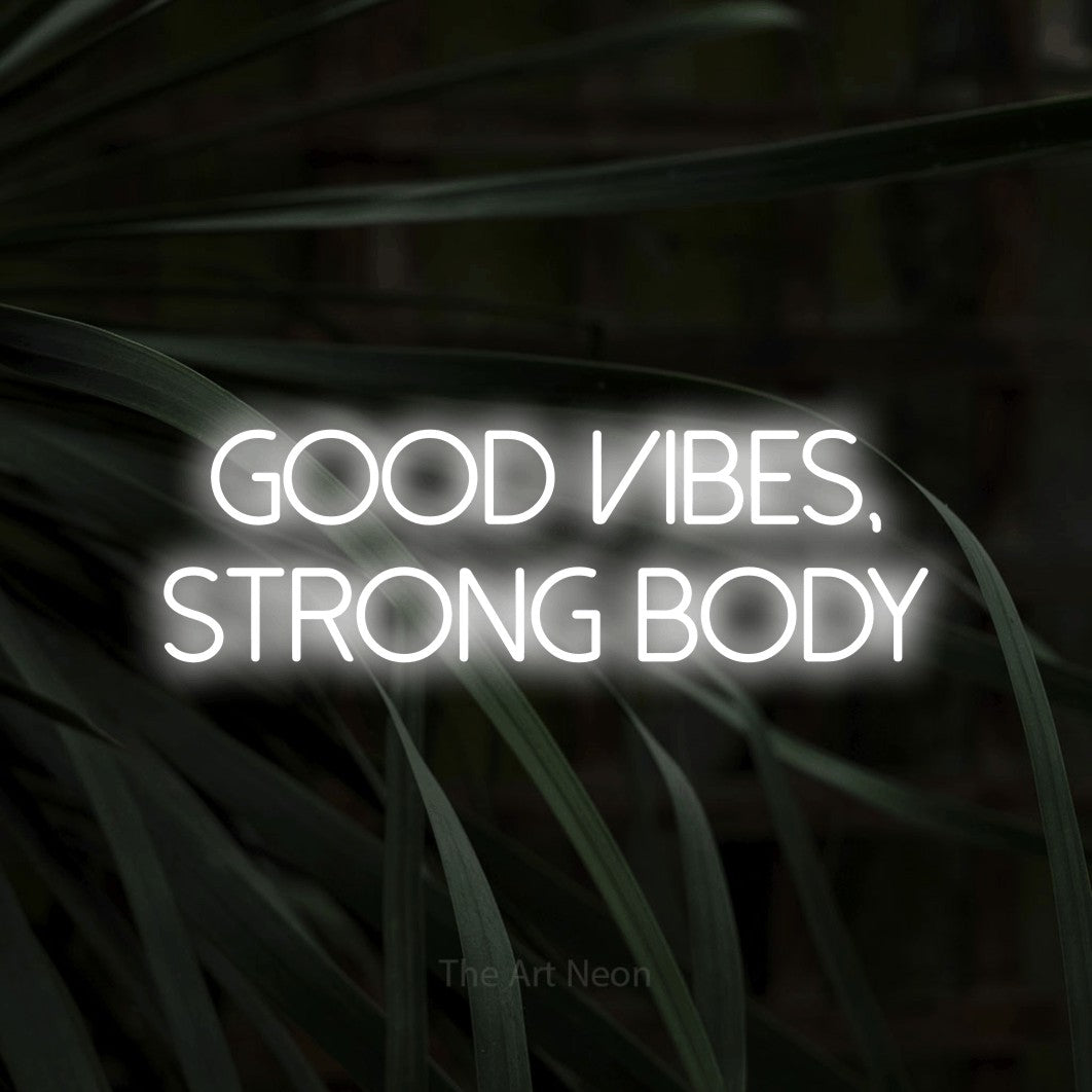 LED neon sign reading “GOOD VIBES, STRONG BODY”, arranged in two lines.