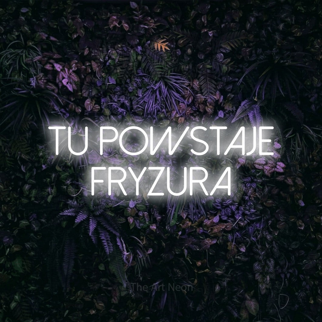 LED neon sign reading “TU POWSTAJE FRYZURA”, arranged in two lines.