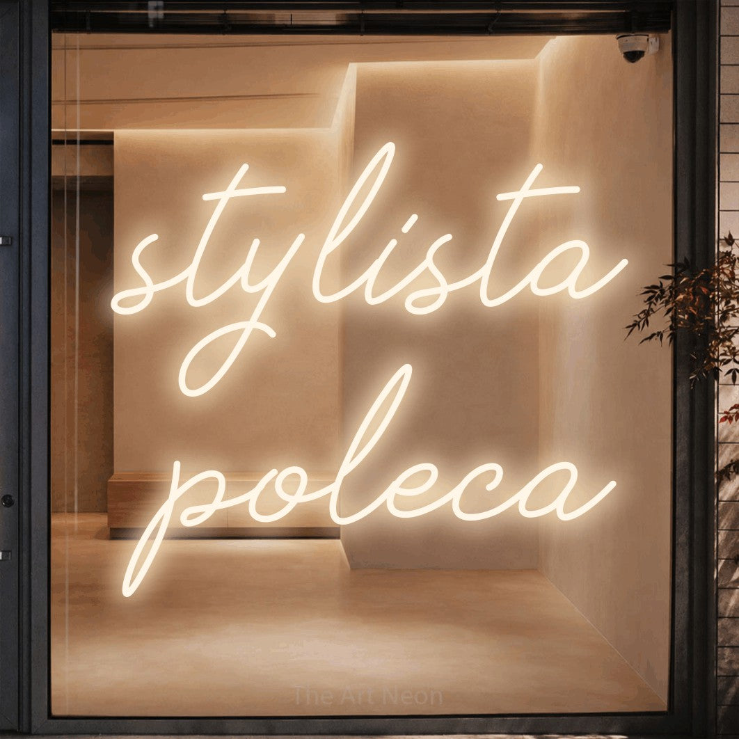 LED neon sign reading “stylista poleca”, arranged in two lines.