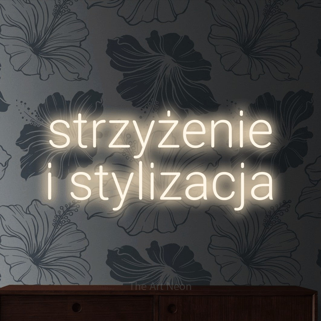 LED neon sign reading “strzyżenie i stylizacja”, arranged in two lines.