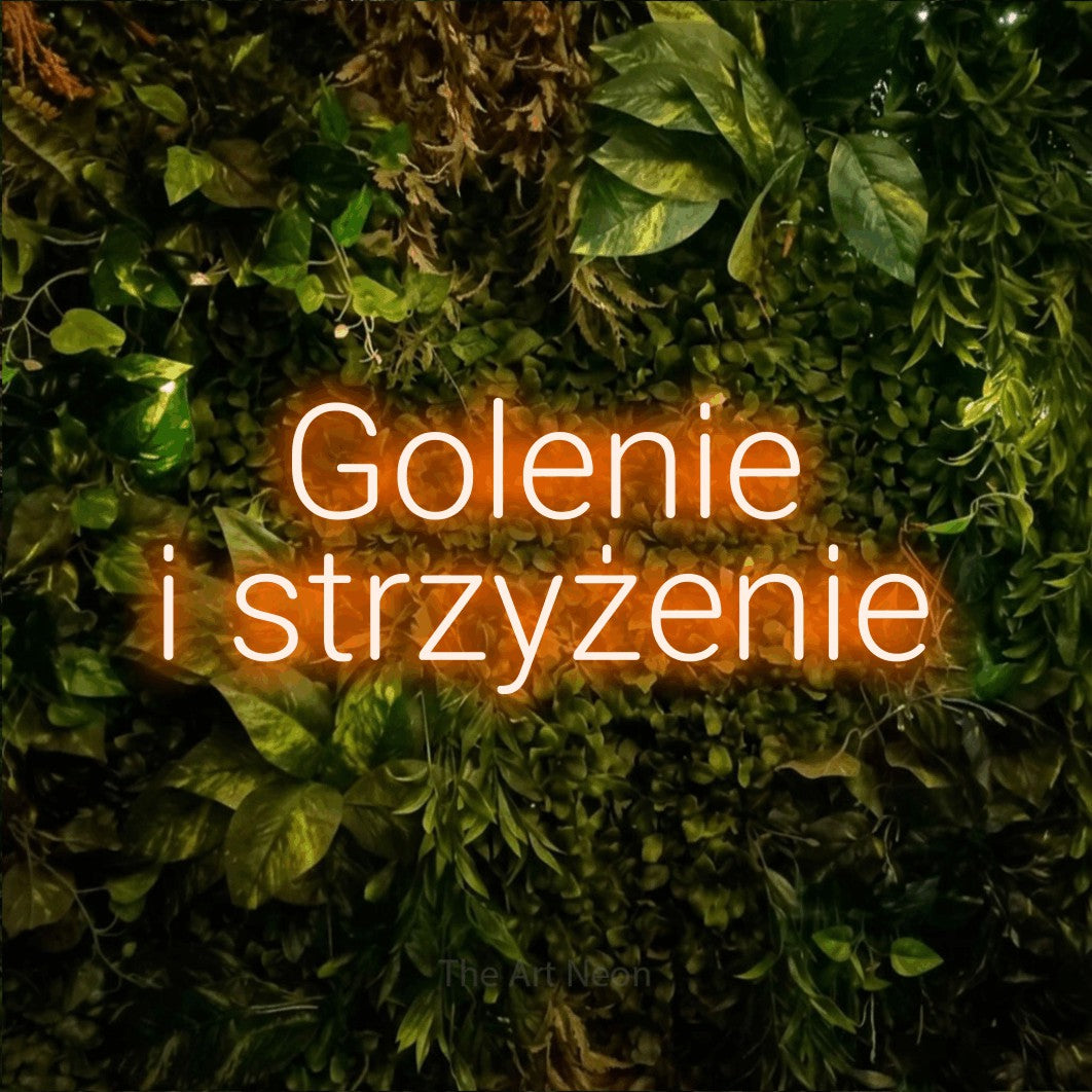 LED neon sign reading “Golenie i strzyżenie”, arranged in two lines.