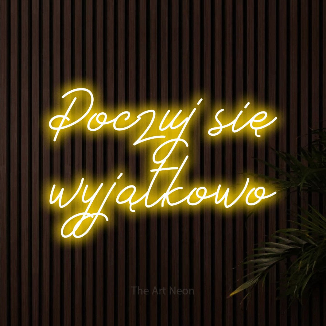 LED neon sign reading “Poczuj się wyjątkowo”, arranged in two lines.