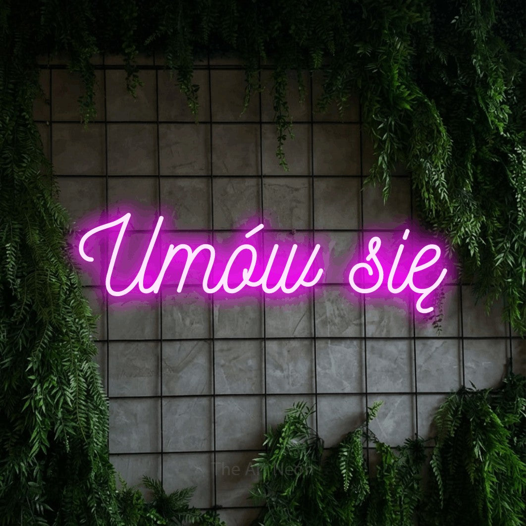 LED neon sign reading “Umów się”, arranged in a single line.
