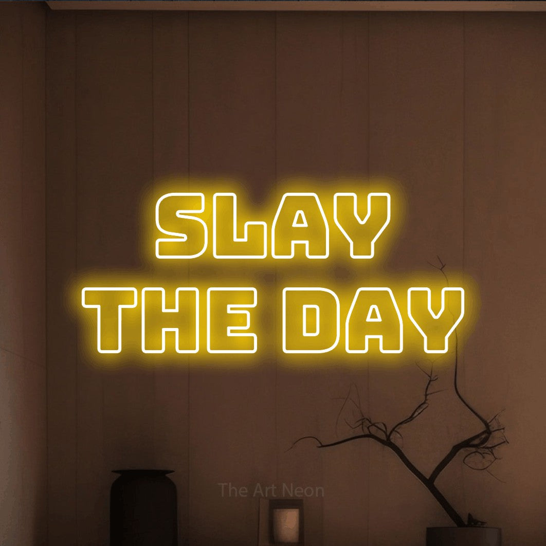 LED neon sign reading “slay the day”, arranged in two lines.
