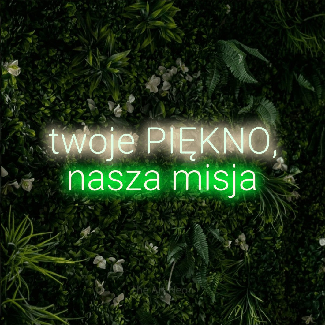 LED neon sign reading “twoje PIĘKNO, nasza misja”, arranged in two lines.