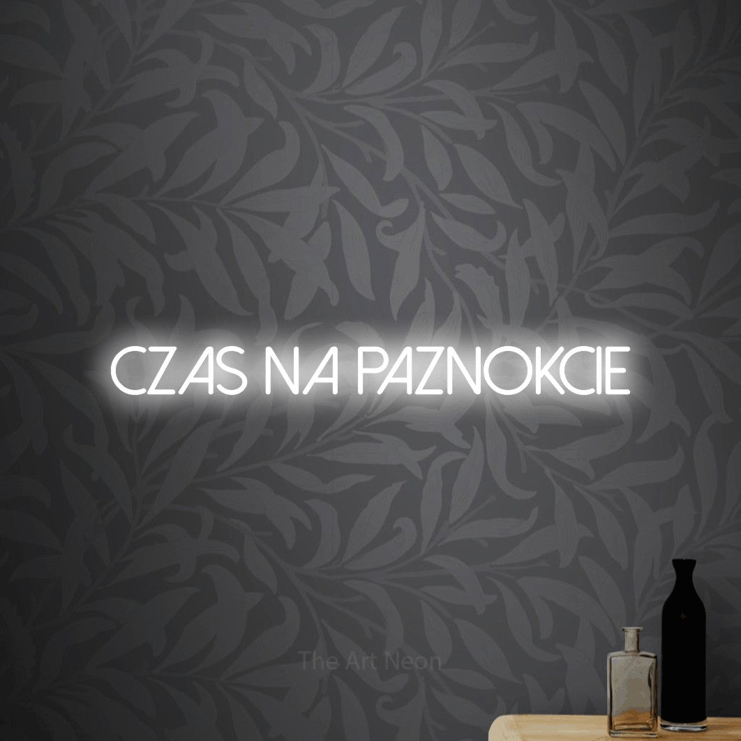 LED neon sign reading “CZAS NA PAZNOKCIE”, arranged in a single line.