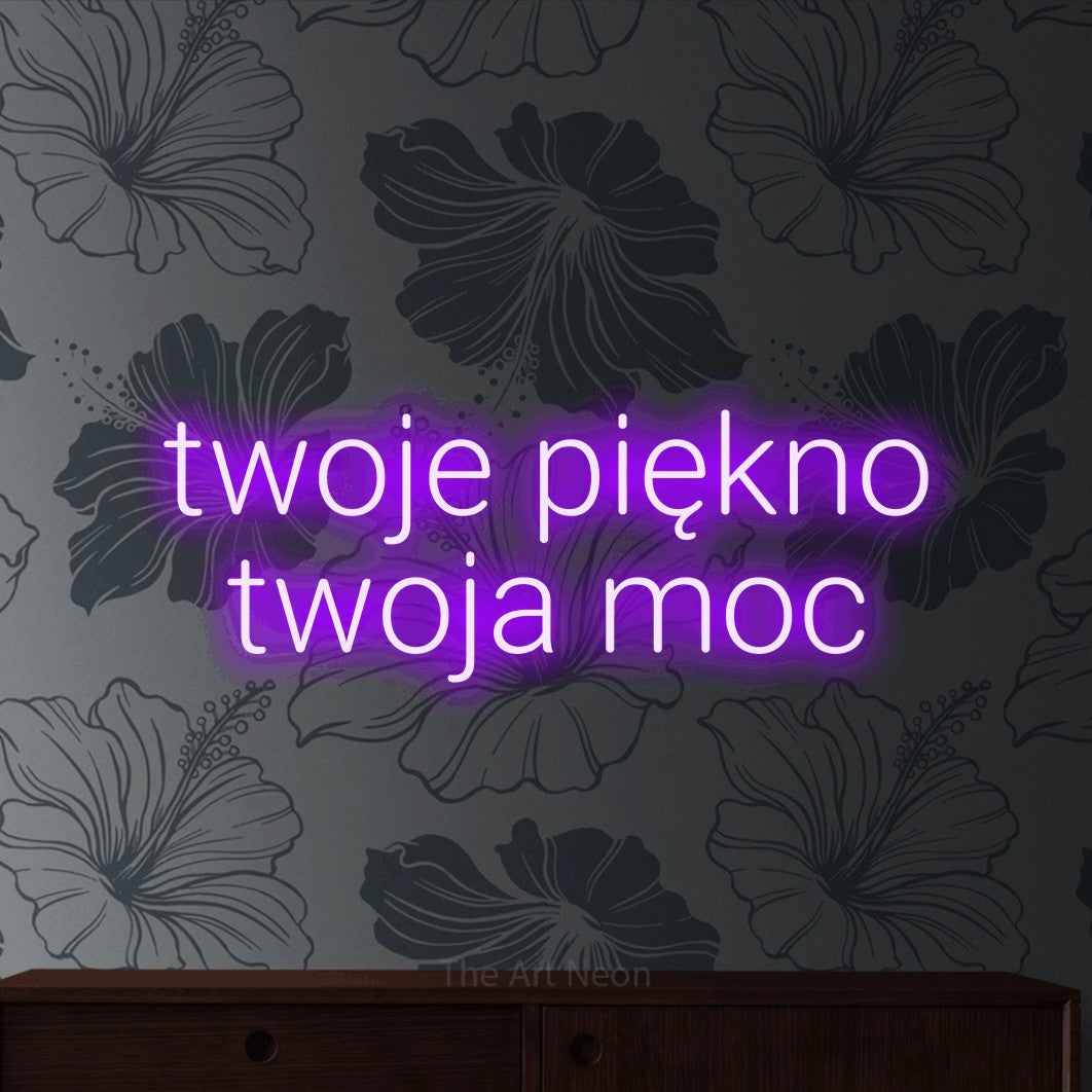 LED neon sign reading “twoje piękno twoja moc”, arranged in two lines.