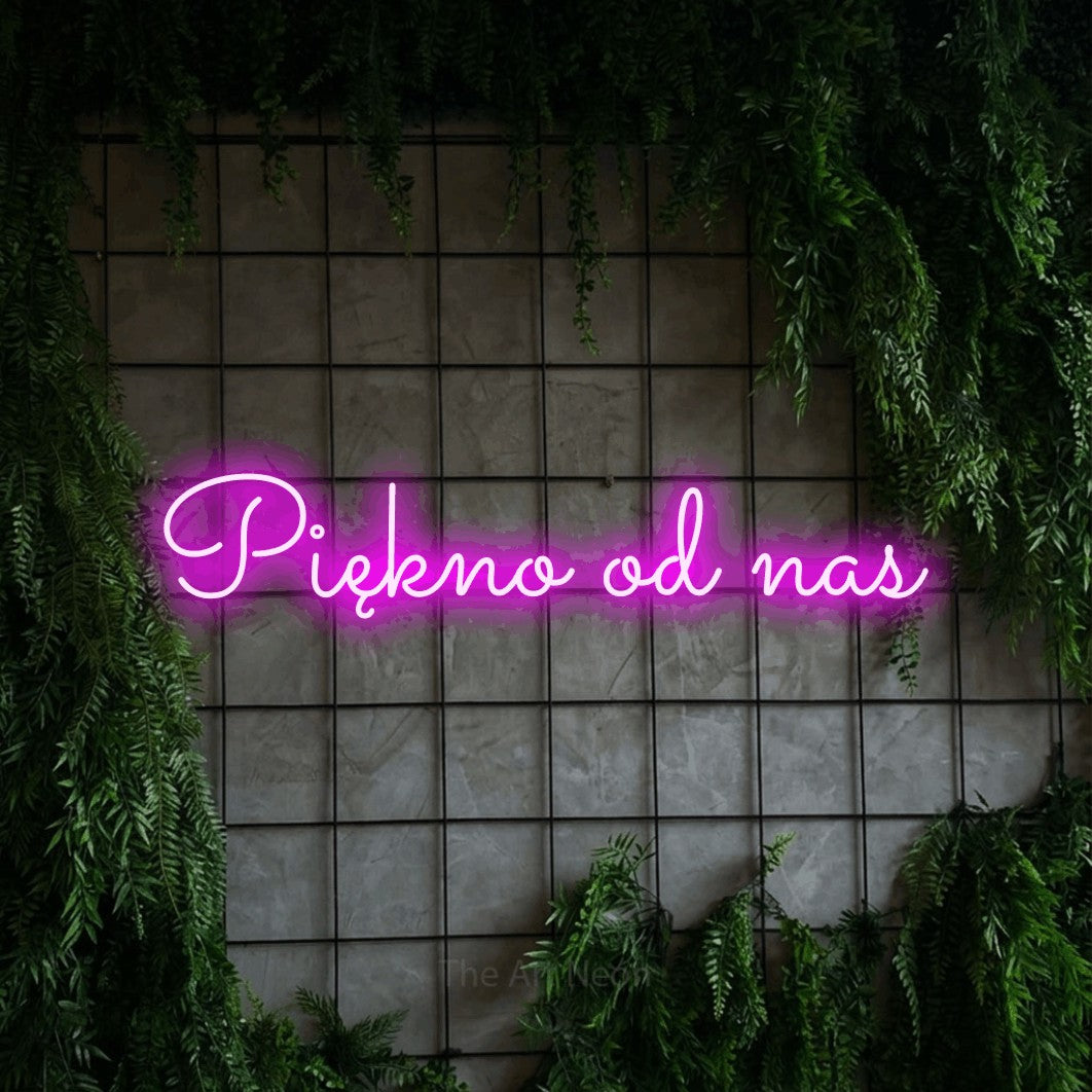 LED neon sign reading “Piękno od nas”, arranged in a single line.