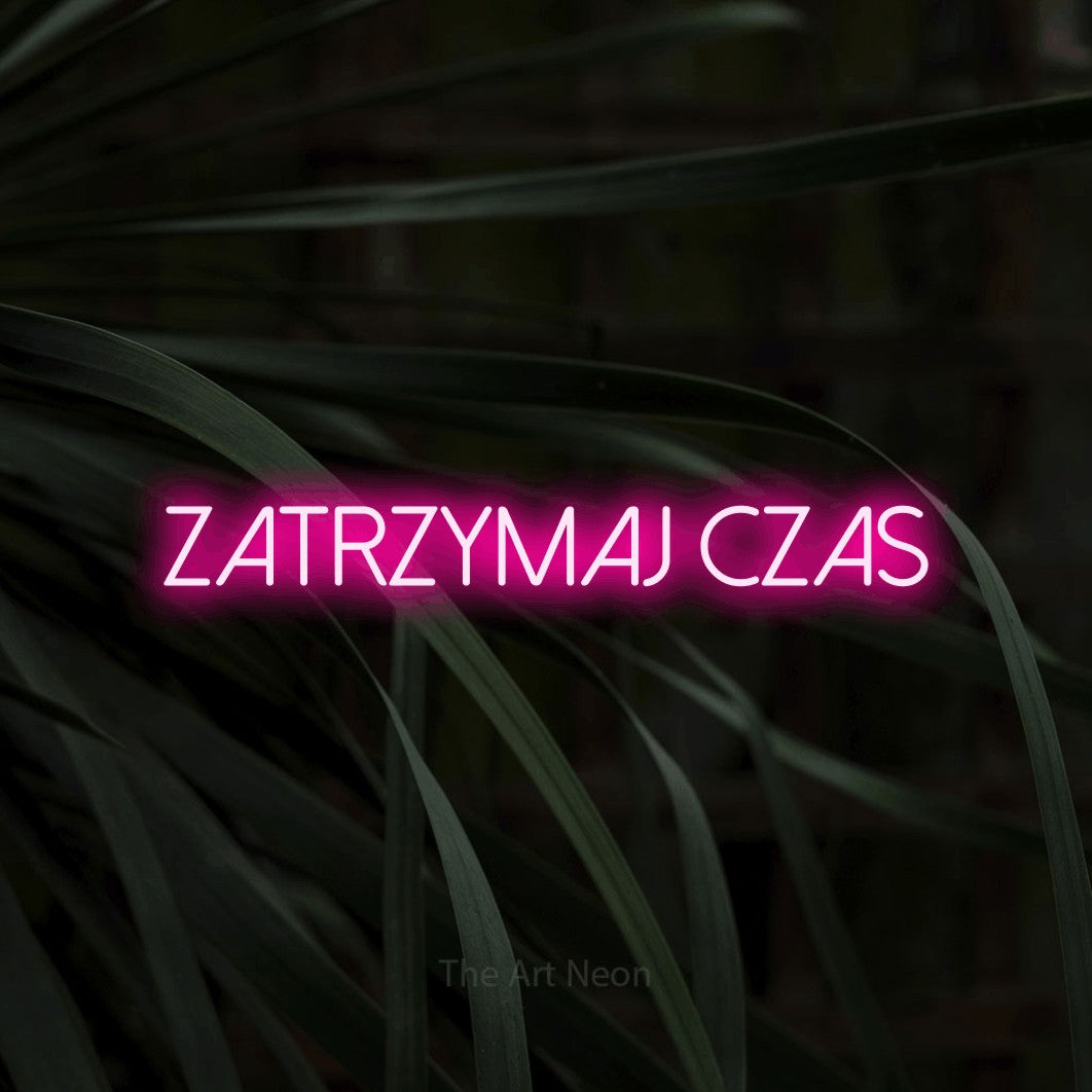 LED neon sign reading “ZATRZYMAJ czas”, arranged in a single line.