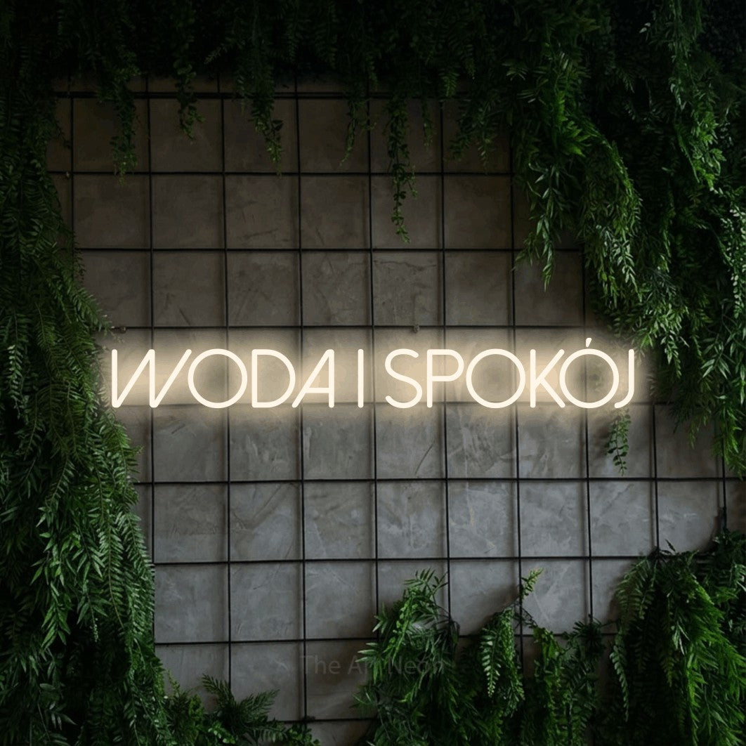 LED neon sign reading “woda i SPOKÓJ”, arranged in a single line.