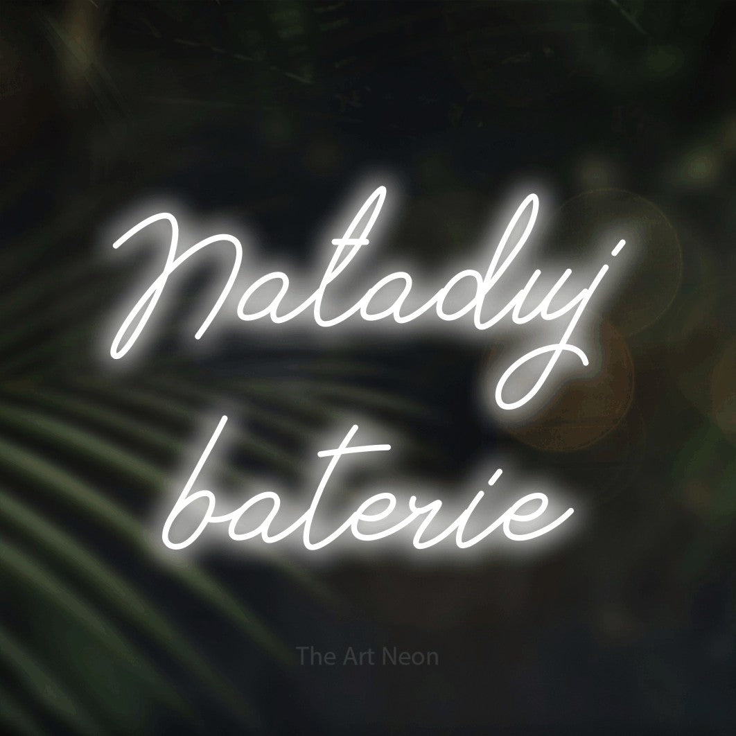 LED neon sign reading “Naładuj baterie”, arranged in two lines.