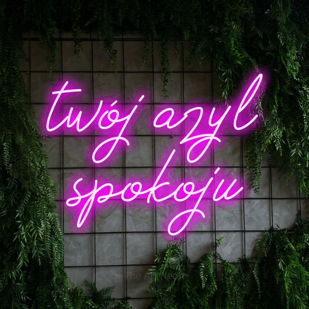 LED neon sign reading “twój azyl spokoju”, arranged in two lines.